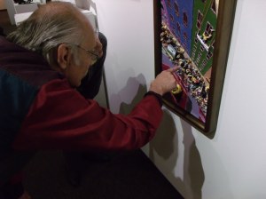 Artist Examining his Work