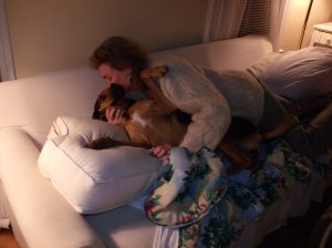 Linda Seyfert cuddling with Daisy on the Couch. 